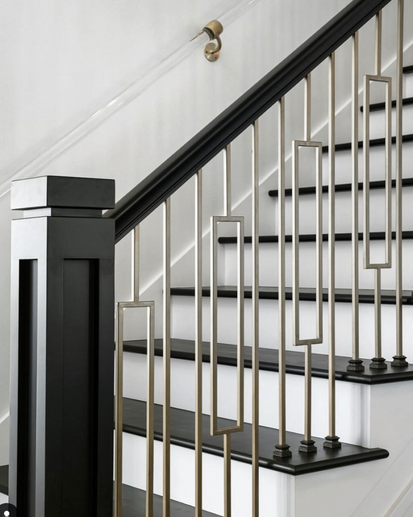 Gold Railings on Black Steps
