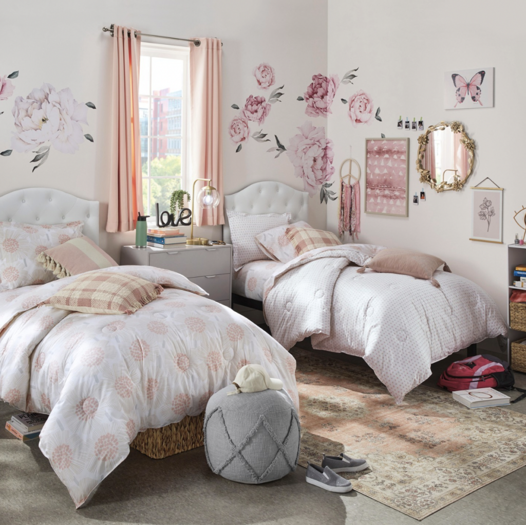 Golden Lamp and Dresser beside Two Beds in a Pink Bedroom