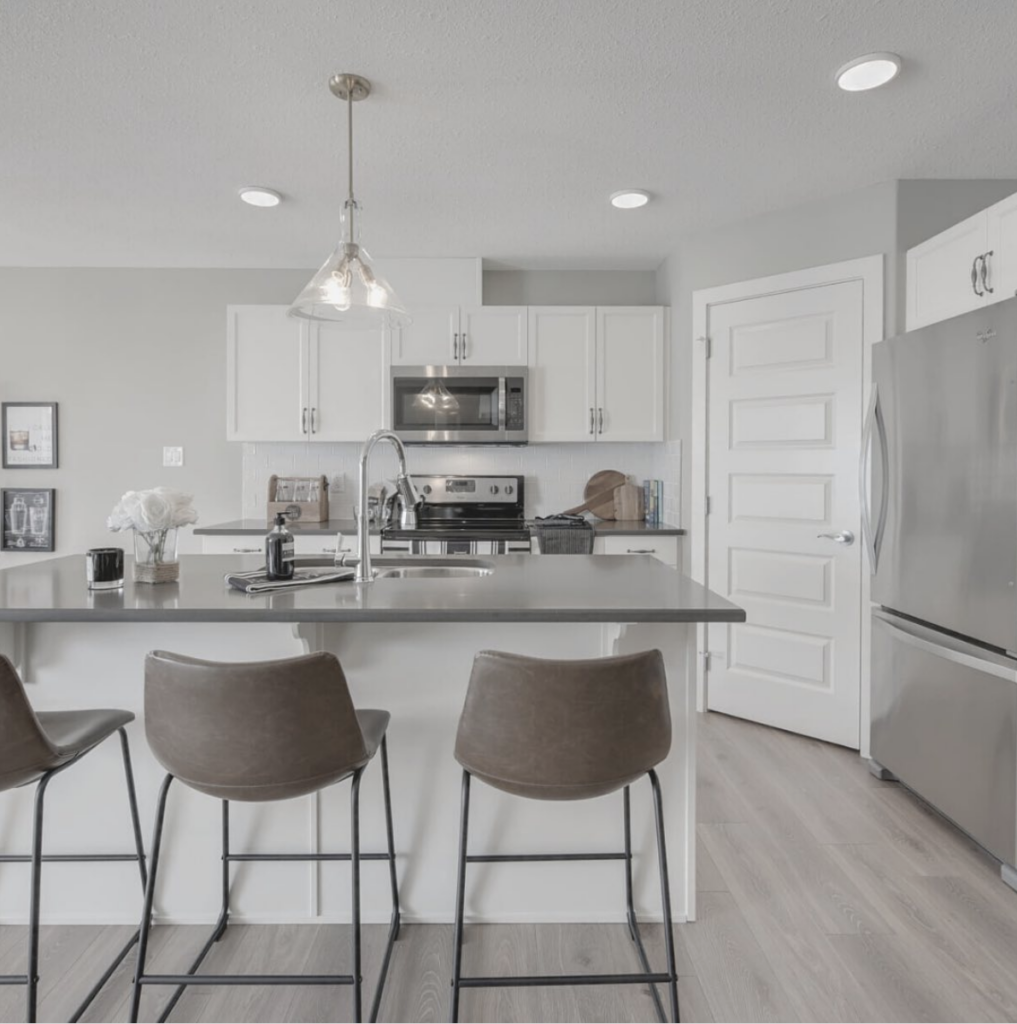 Stainless Steel Appliances And Grey Countertops