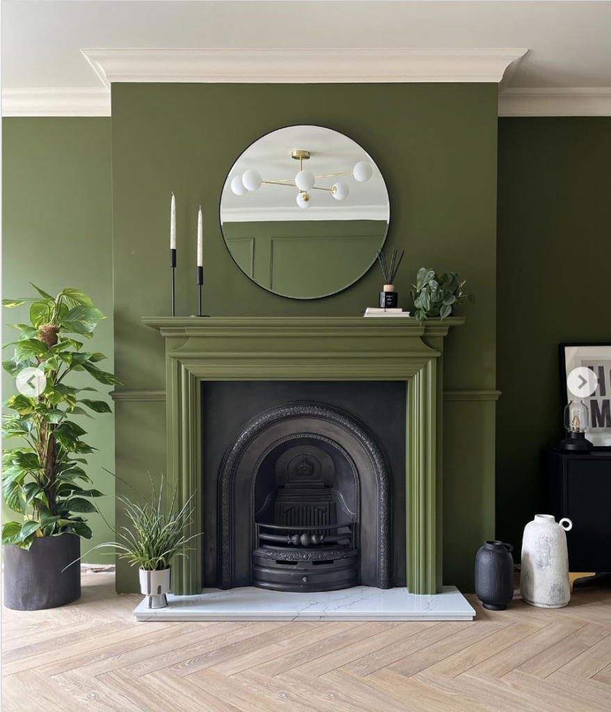 Green Accent Wall with Gray Fireplace