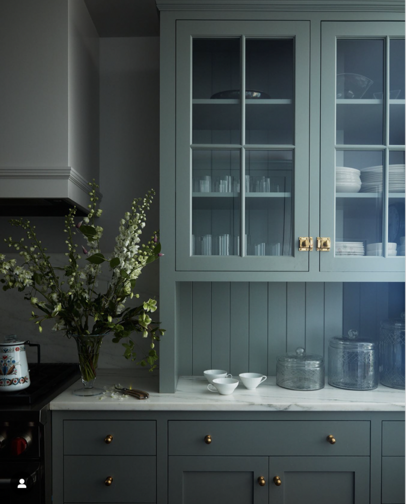Green Cabinet with Gold Metal Hardware