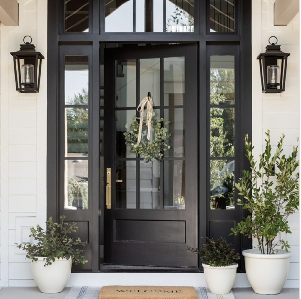 Green Wreath and Black Glass Entry Door