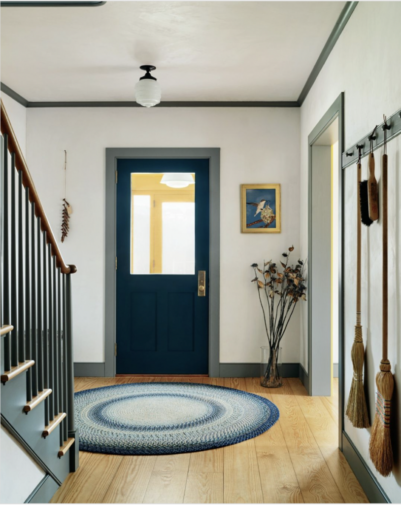 Dark Green Front Door With Grey Baseboard Trimming