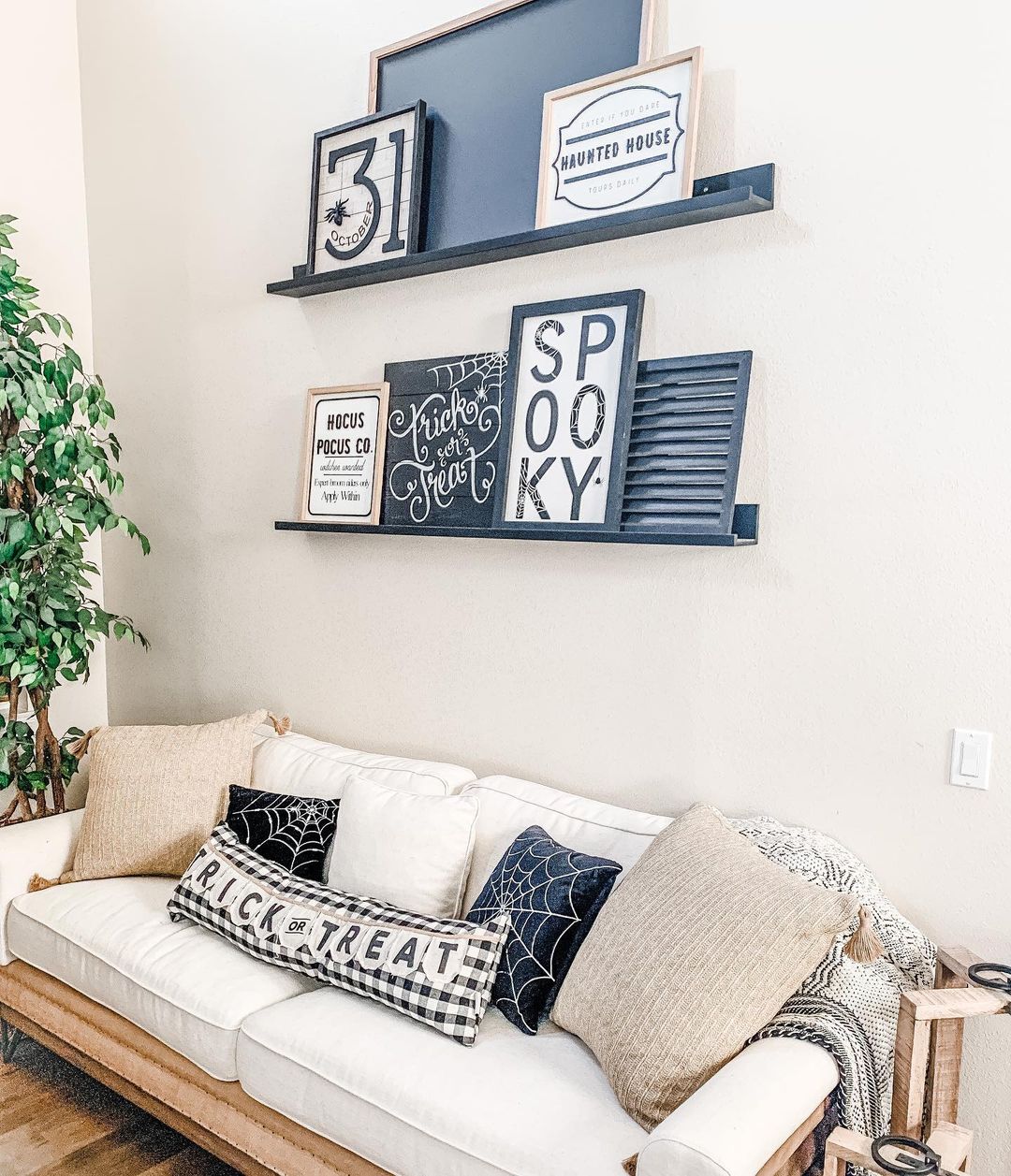 Halloween-Themed Living Room with Festive Picture Ledge Display
