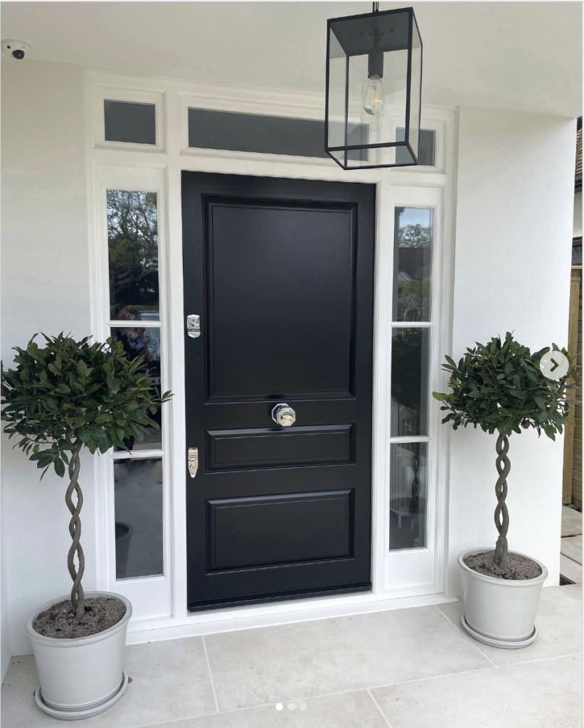Home Exterior with a Windowed Black Front Door