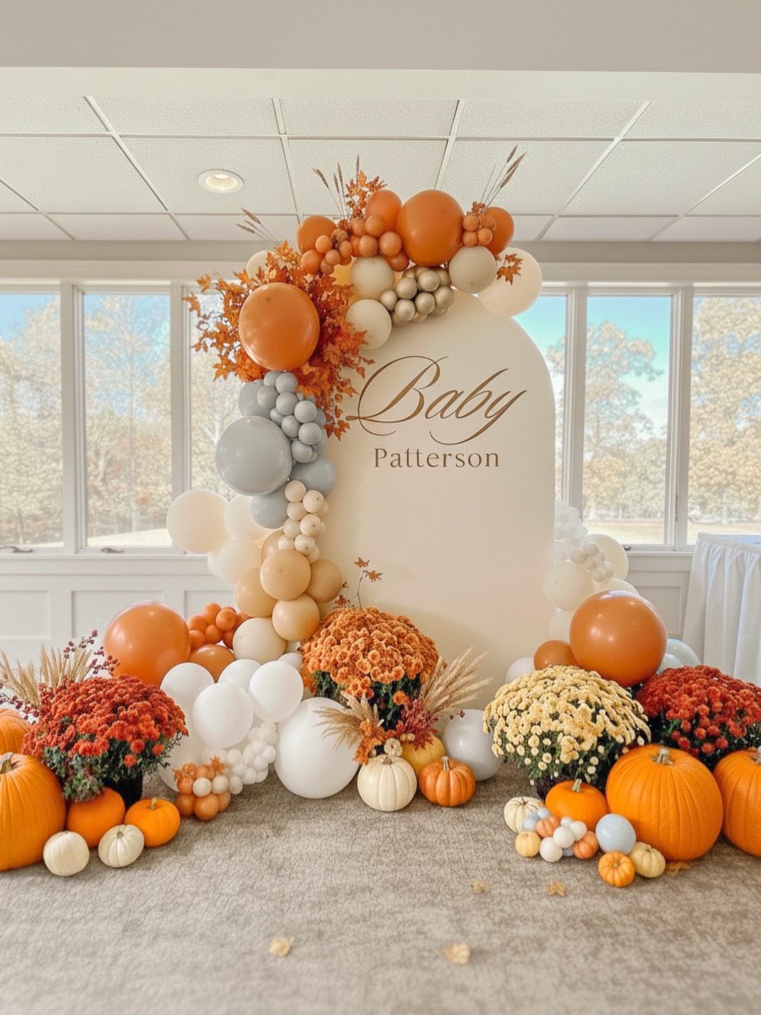 Indoor Fall Baby Shower with Mums and Pumpkins