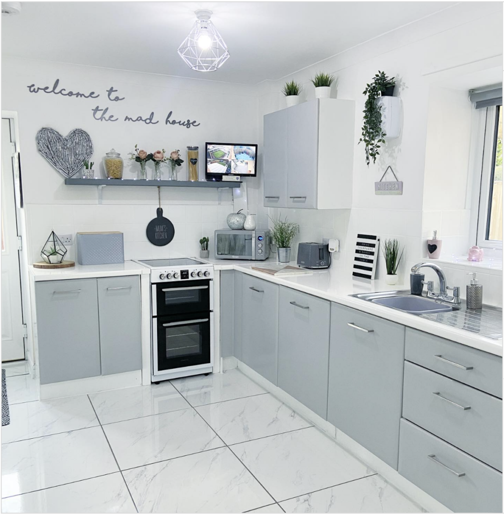 L-Shaped Kitchen with Gray Cabinets and White Tile Floors