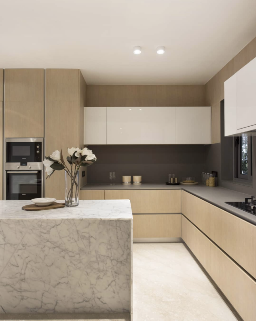 Light Wood Cabinets Kitchen With Marble Island