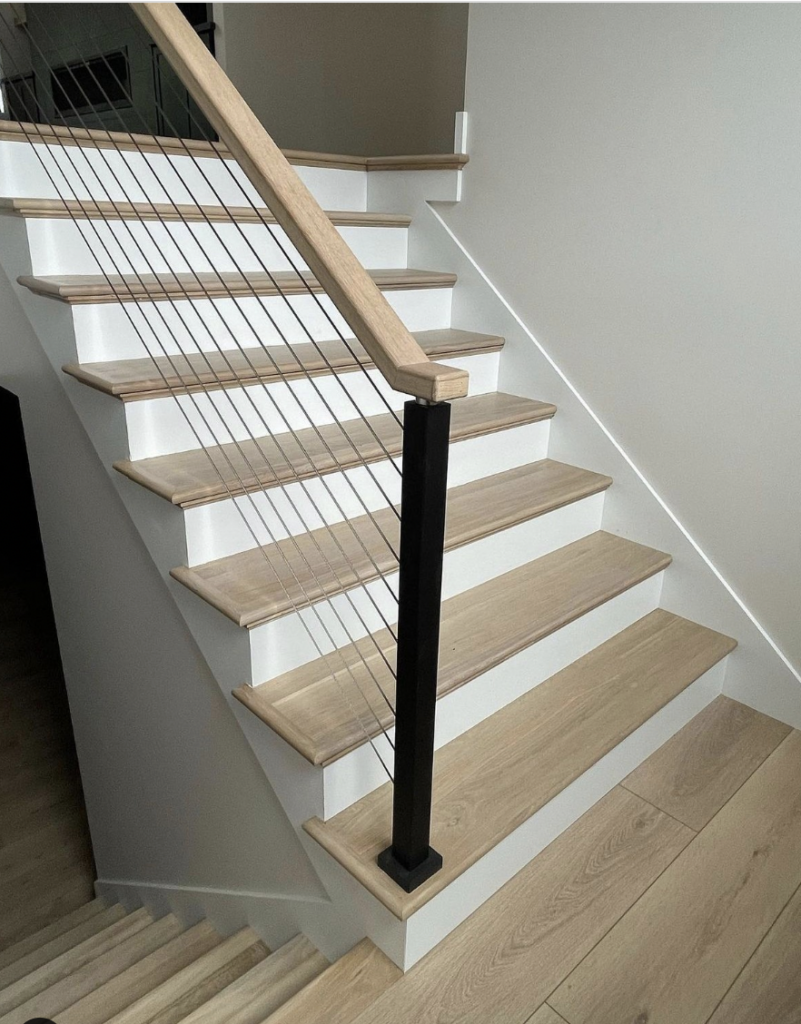 Light Wood Stair Steps Paired with White Door Trim