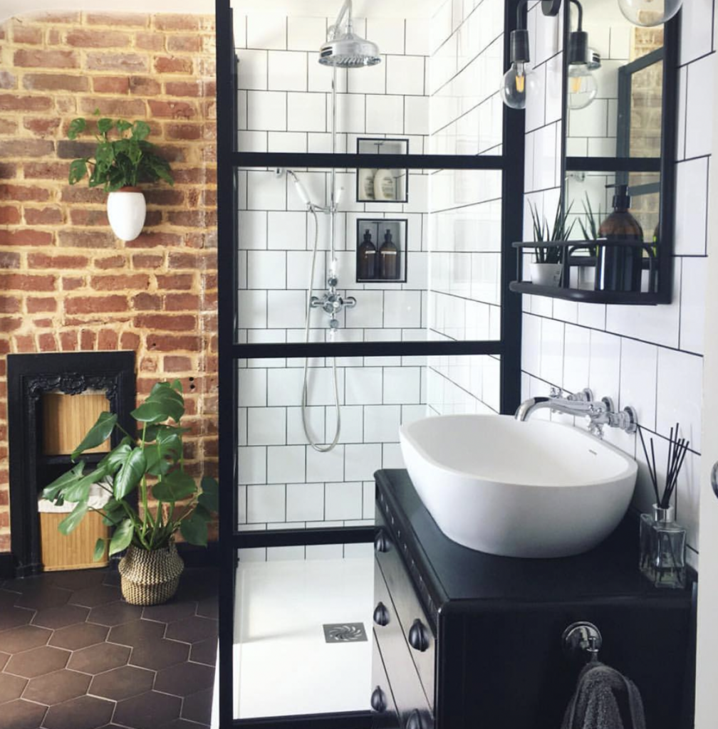 Marble Backsplash in a Small Brown Powder Room