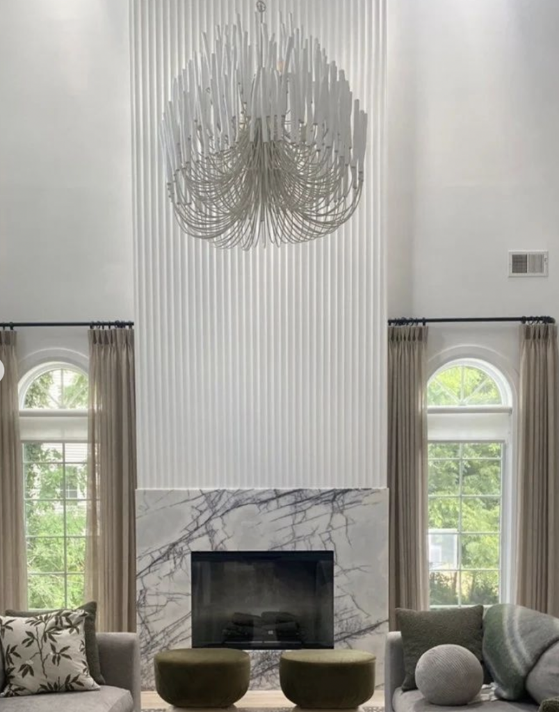 Marble Fireplace Against White Wall Paneling
