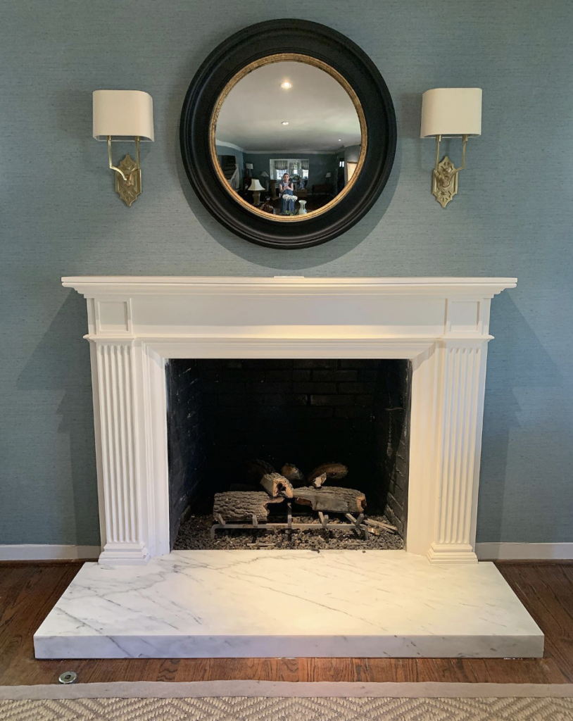 Marble Hearth and White Fireplace for Reflected Natural Light Airiness and Brightness