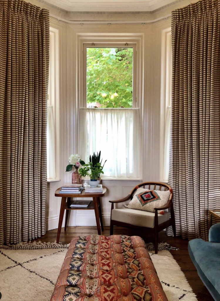 Minimalist Bay Window with a Floor-to-Ceiling Curtain
