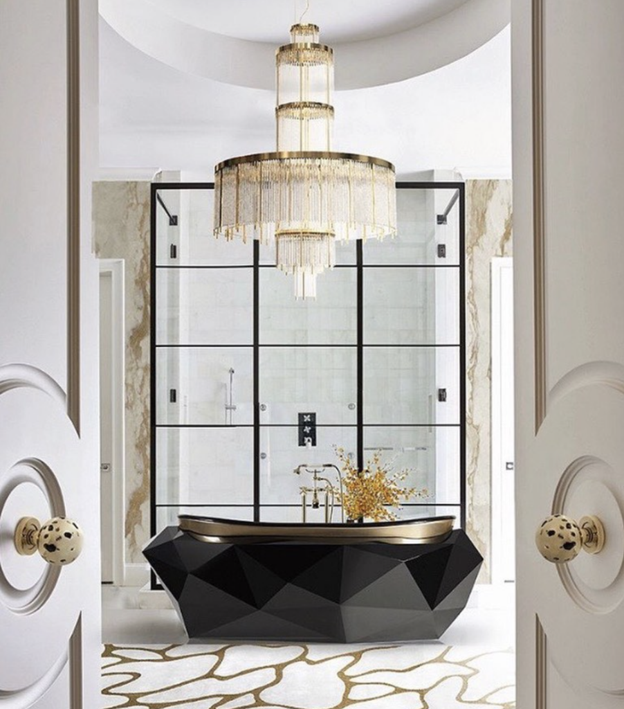Modern Black Tub with an Overhead Gold Chandelier