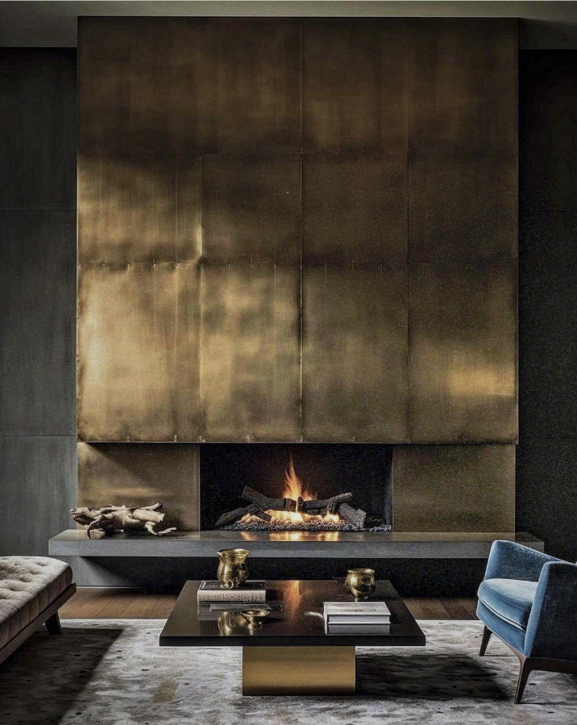 Modern bronze fireplace with a soft glow and subtle sheen