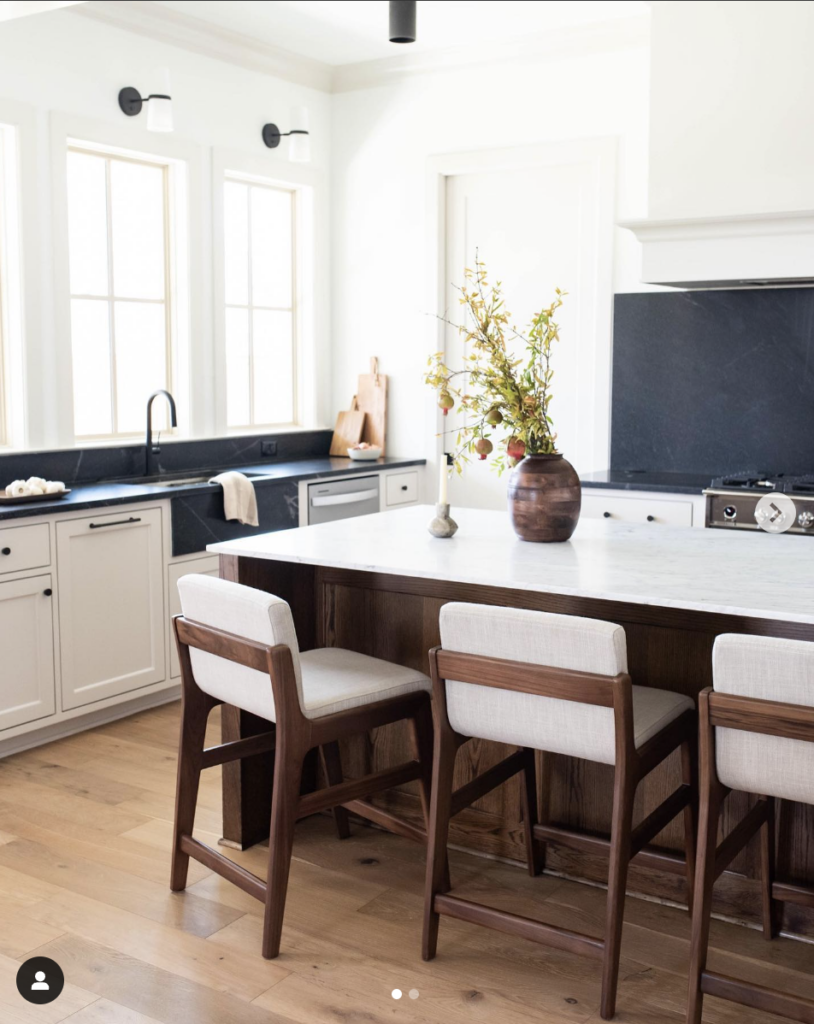 Modern Kitchen with White Cabinets and a Black Countertop