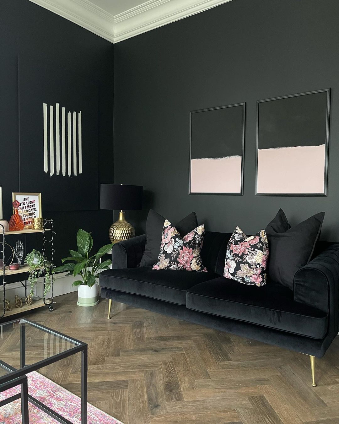 Black Couch in a Monochrome Palette with Floral Accents