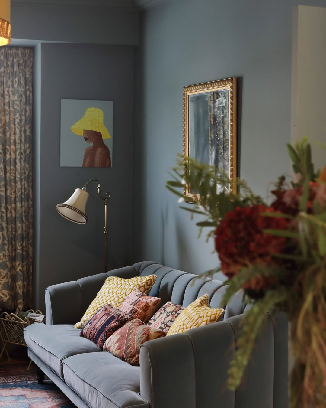Moody Blue Pattern Mix with Blue-Gray Walls and Velvet Sofa