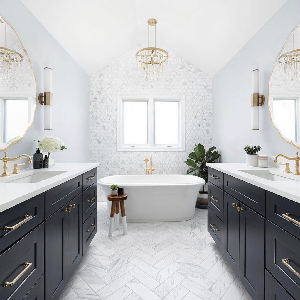 Multiple Dark Bathroom Vanities and a Chandelier