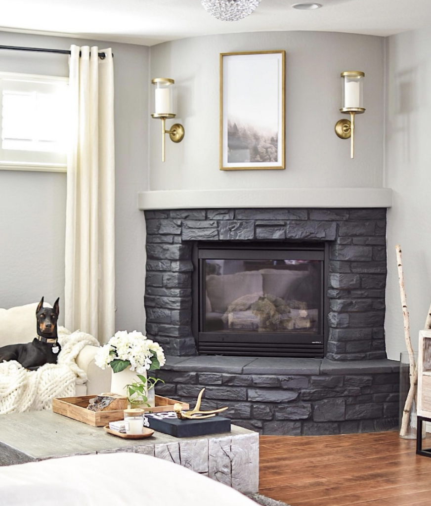 Off Center Black Stone Living Room Fireplace Lighting Ideas