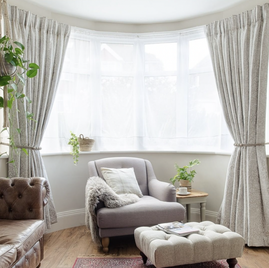 Off-White Curtains with a Curved Rod