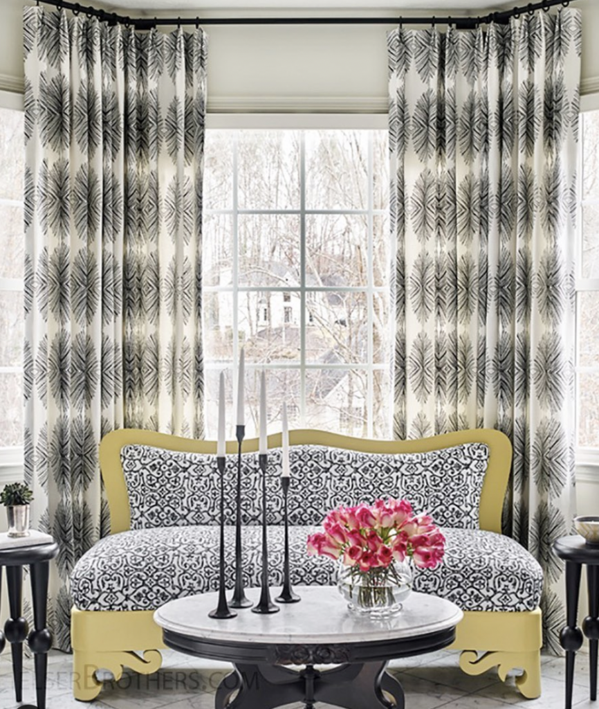 Patterned White Curtains Behind Couch Windows