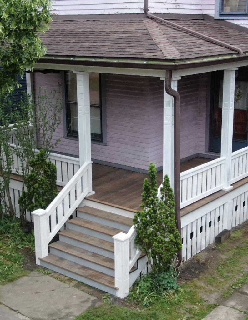 Pink House Fronted by White Railing