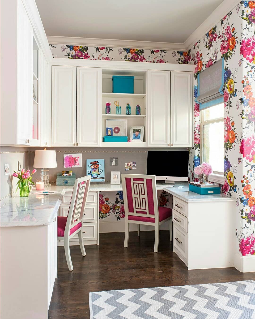 Practical U-Shaped Desk Behind a Vibrant Floral Wall Mural