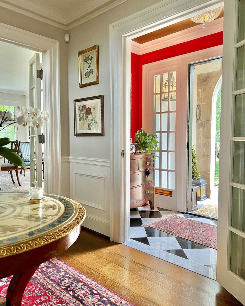 Red Accent Wall, Checkerboard Flooring and a Harmonious Cohesive Daring Traditional Pairing