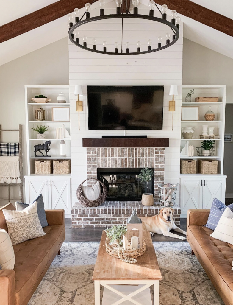 Red Exposed Brick Fireplace Flanked by Built-Ins