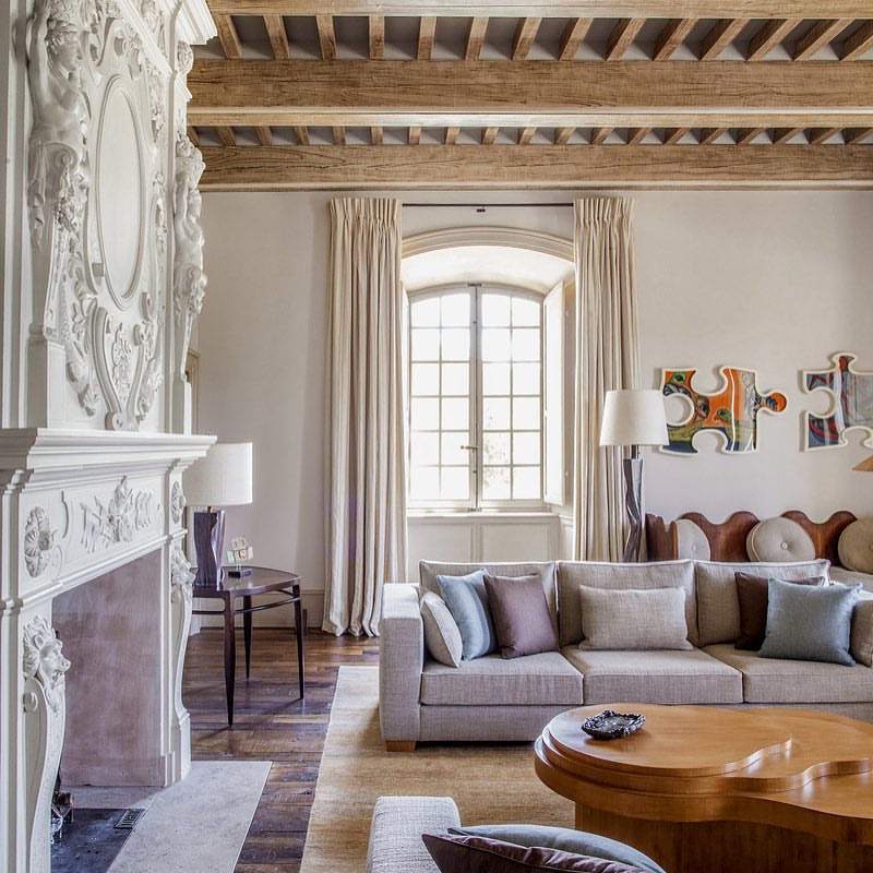 Robust Wood Beams With a Baroque Fireplace