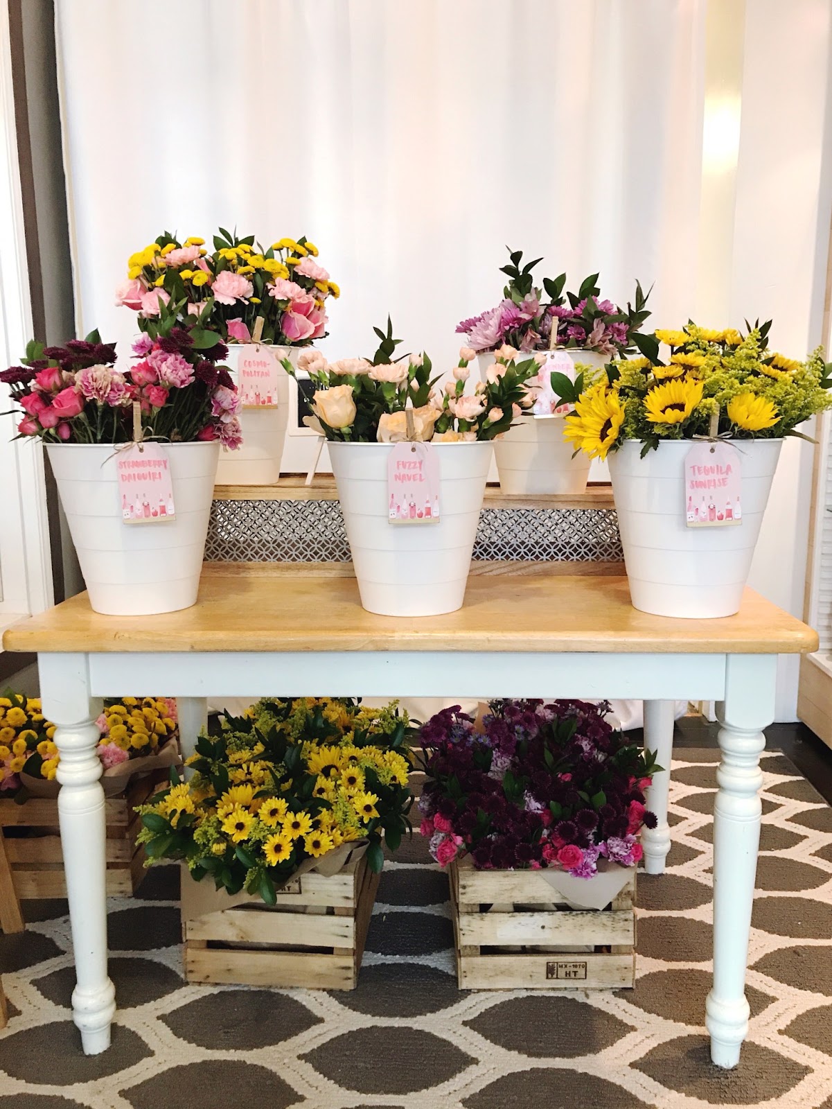 Rustic Wooden Table with White Buckets and Mixed Blooms