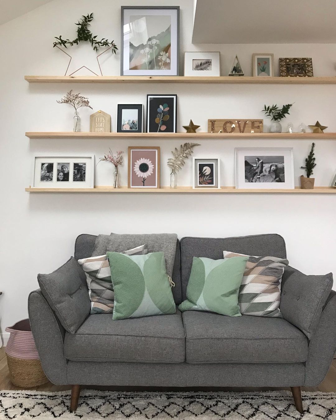 Scandinavian-Inspired Living Room with Layered Picture Ledge Display