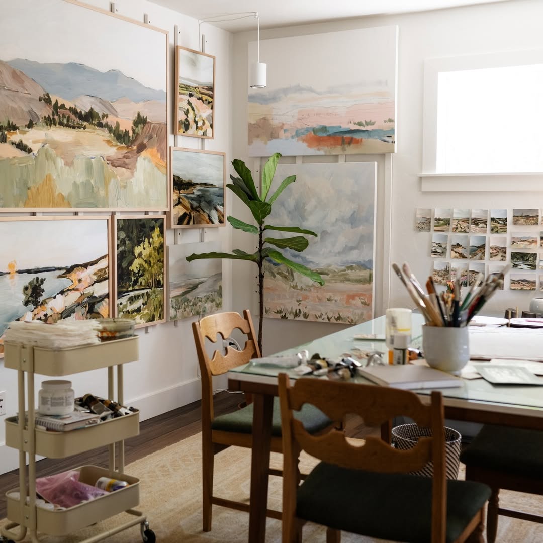 Serene Desert Studio with Framed Landscapes and a Long Art Table