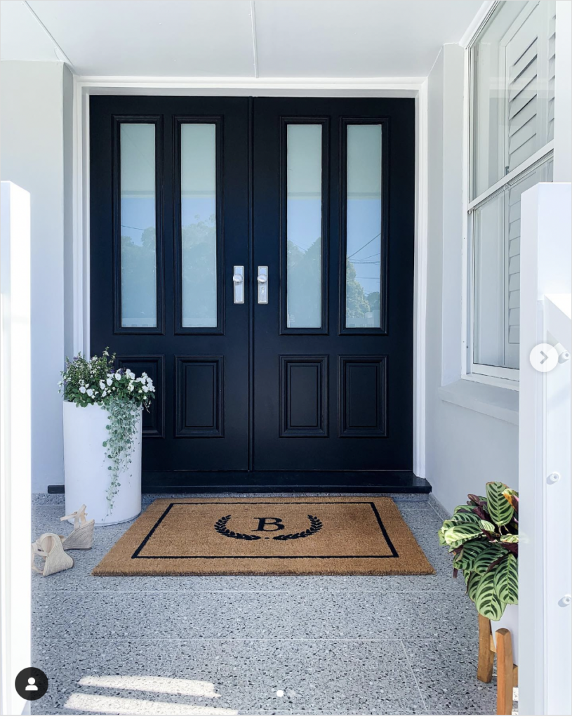 Silver Hardware on a Sleek Black Double Door