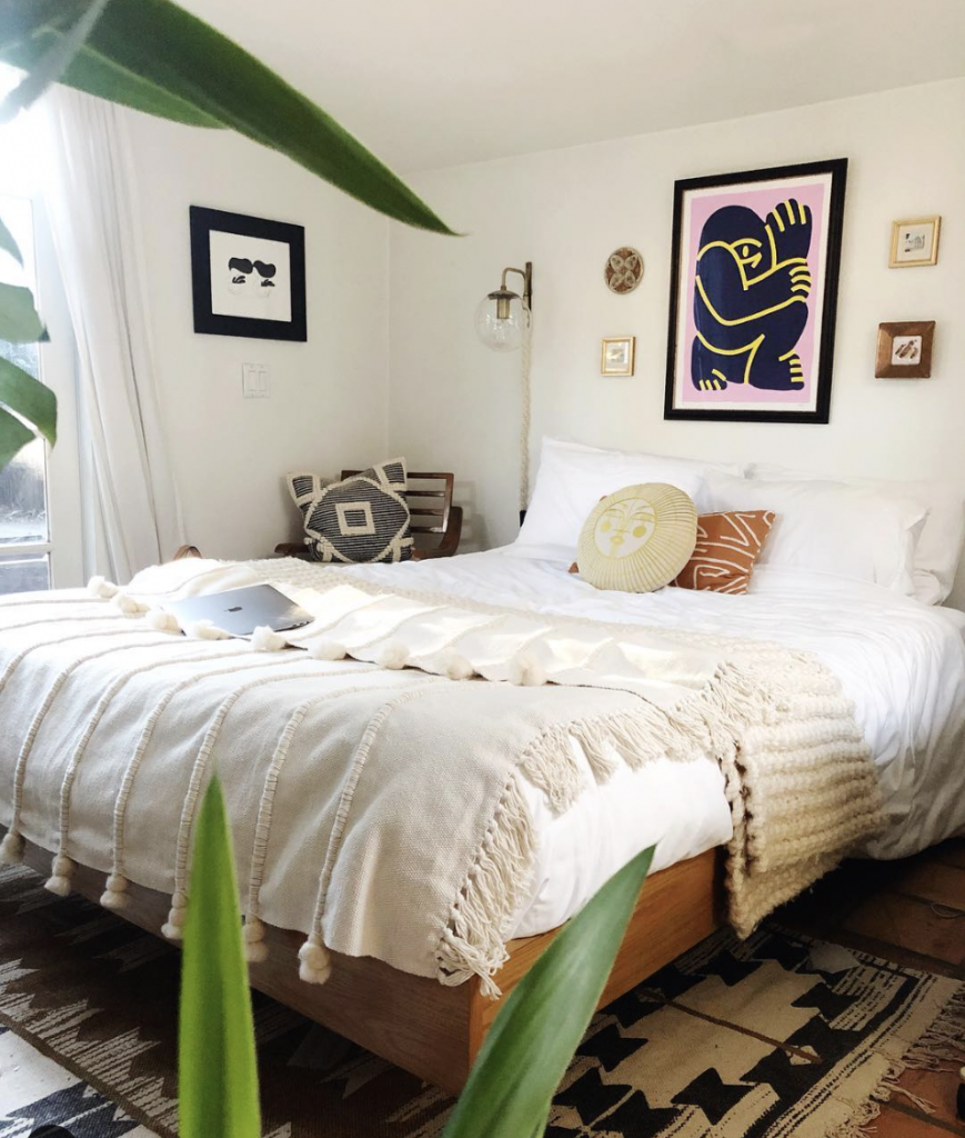 Small Art Collection on a Bedroom Accent Wall