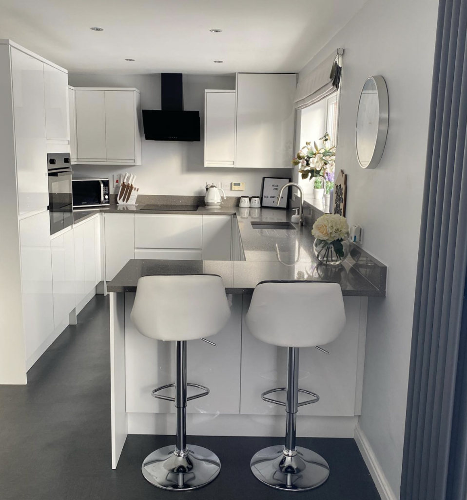 Small White Kitchen Remodel With Dark Grey Countertop