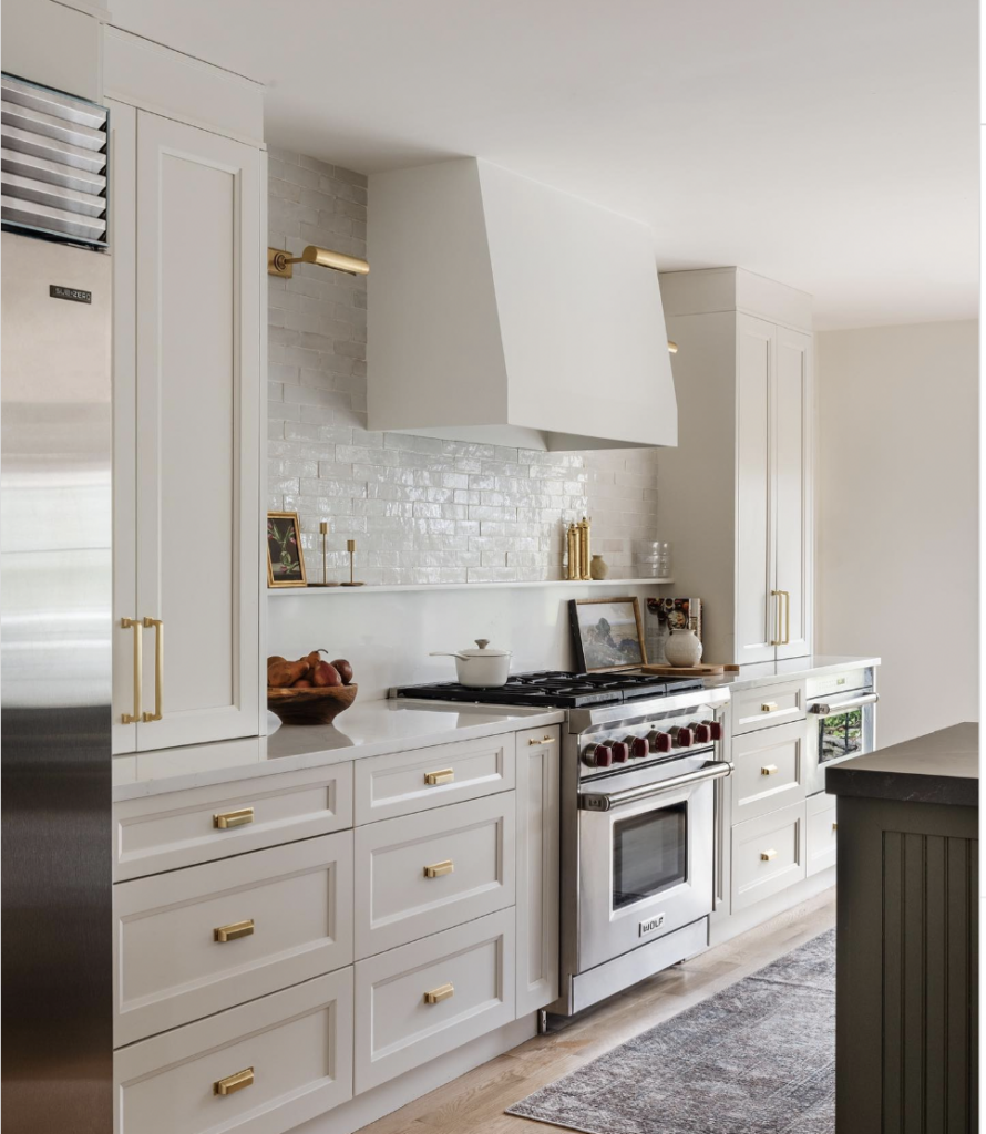 Stainless steel appliances in a beige kitchen