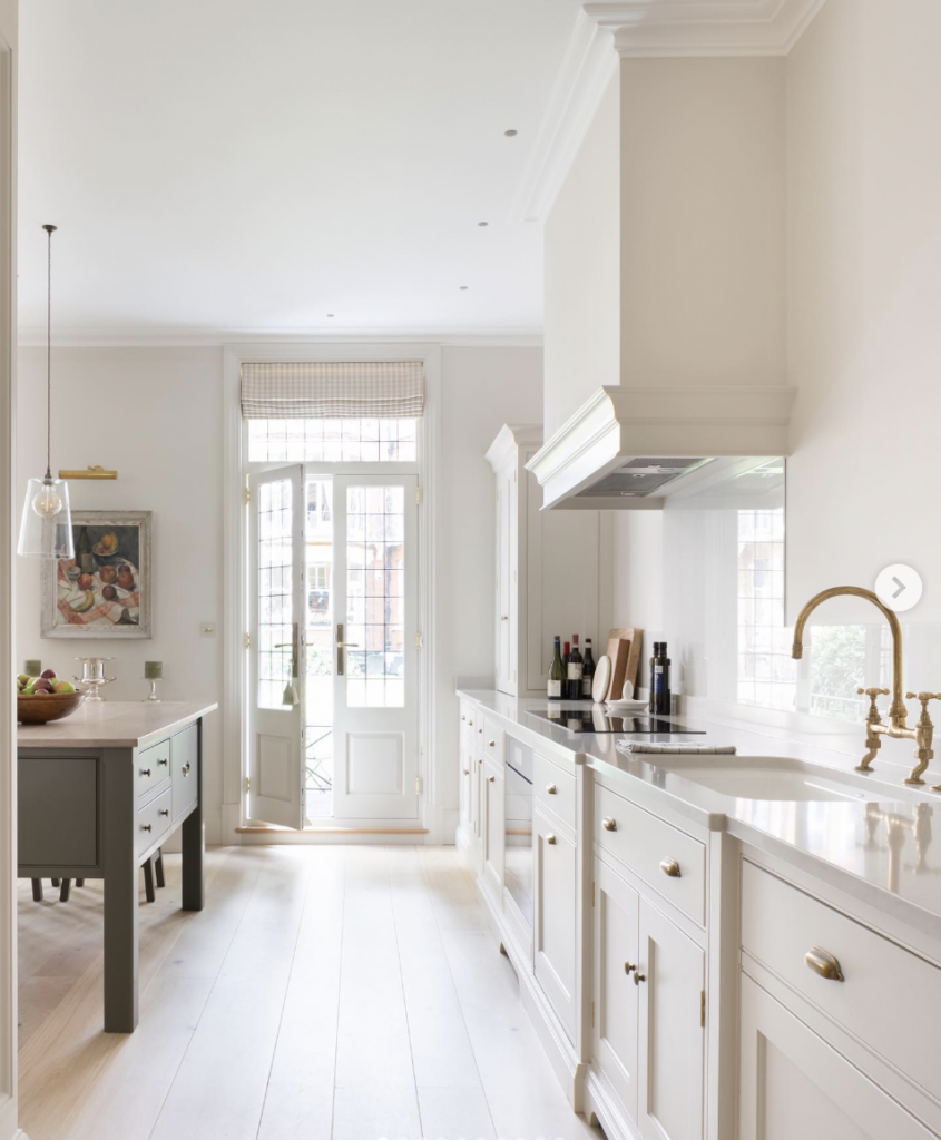 Tan Cabinets with a Gold Faucet