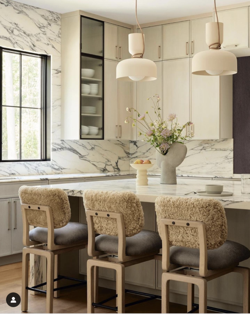 Transparent Glass Cabinets with Marble Backsplash