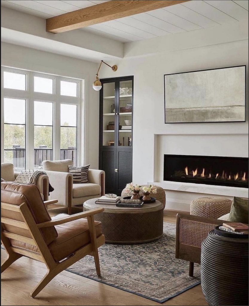 White and black contrast electric fireplace hearth with TV above