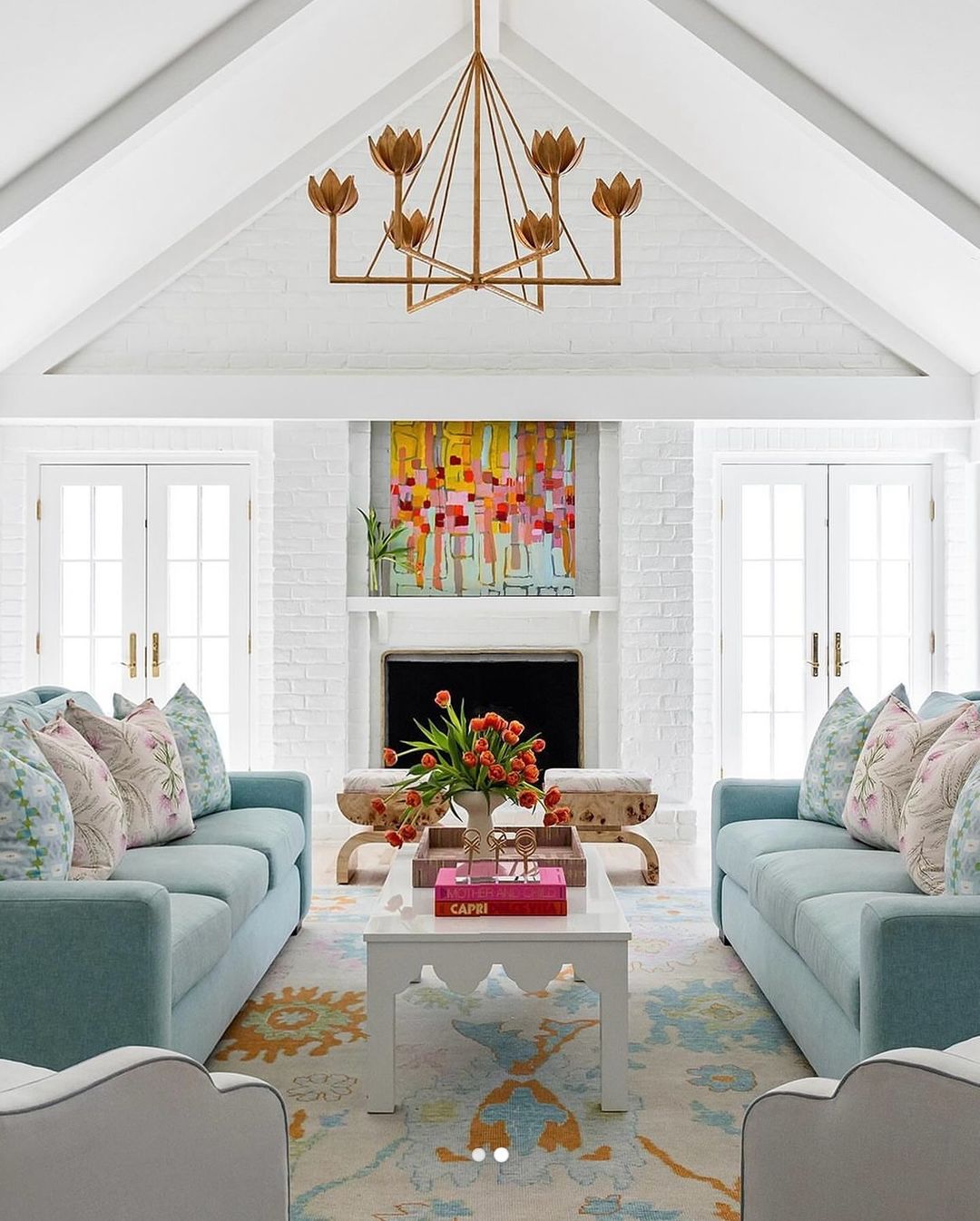 Vibrant High-Ceiling Loft with Floral Chandelier