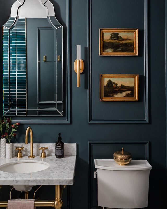 Vintage Art and Luxurious Fixtures for an Elegant Bathroom