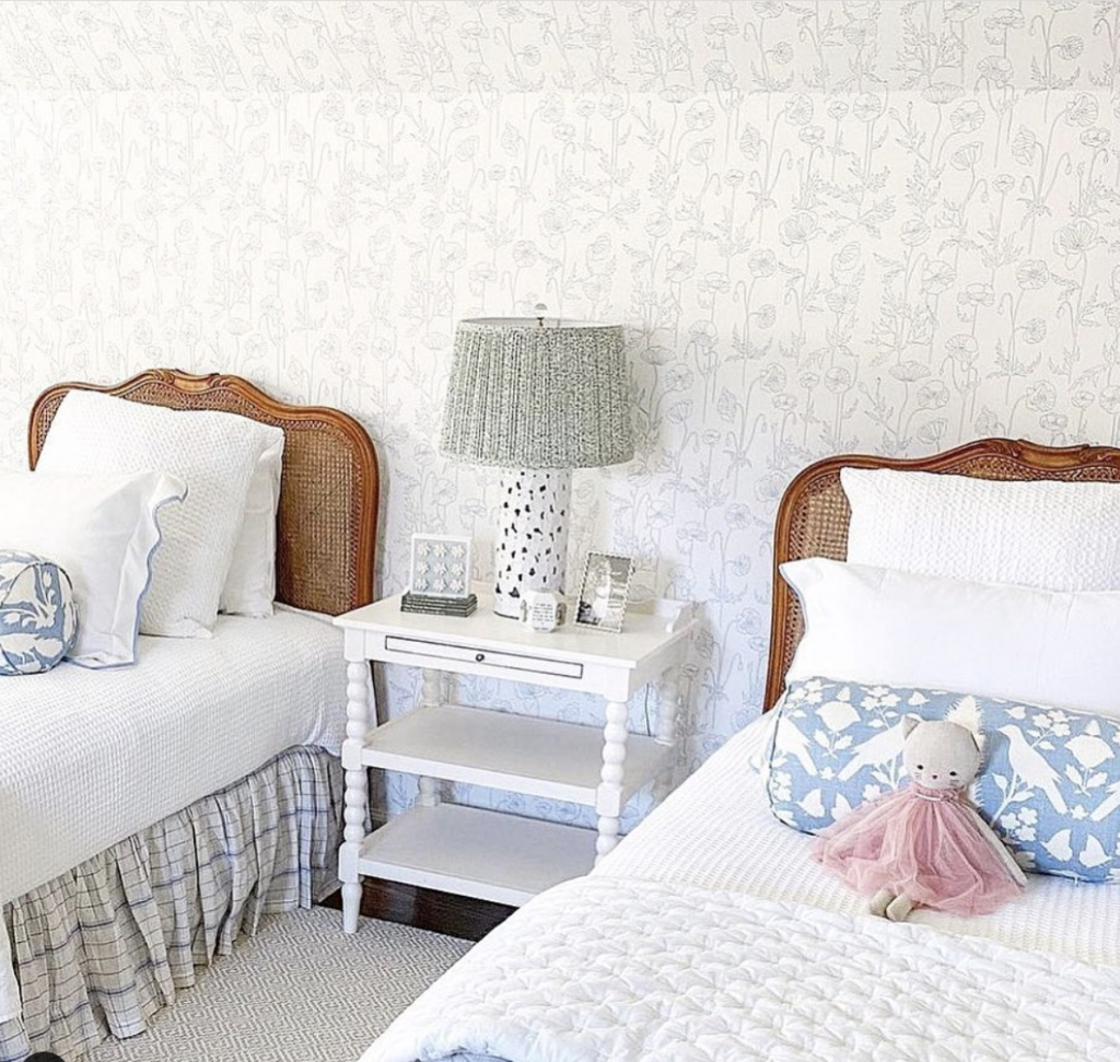 White and Gray Wall Mural with Wooden Beds and Blue Pillow