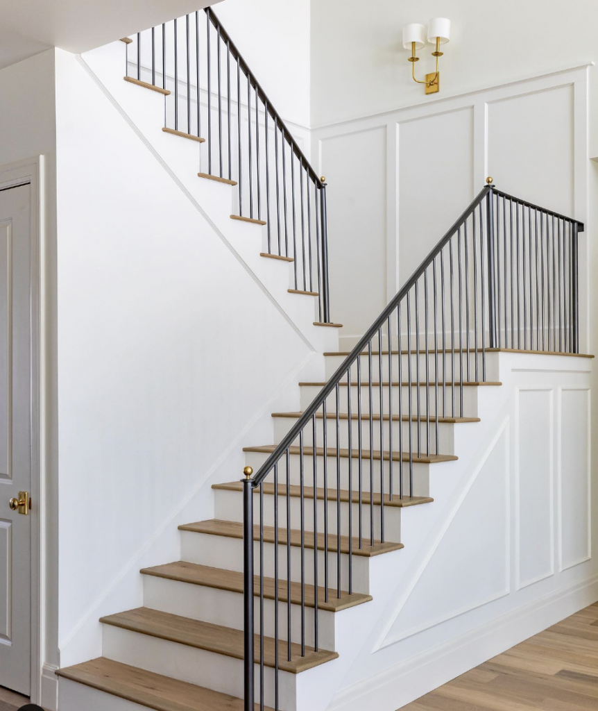 White Baseboard Trim with Rich Wood Steps