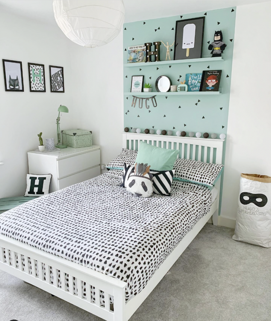 White Bed Set in a Black and Sage Green Bedroom