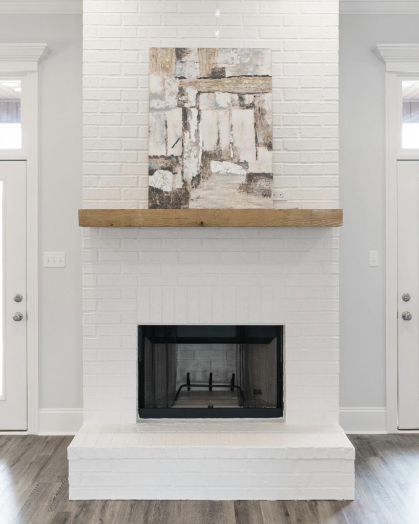 White Brick Fireplace with Floating Shelf