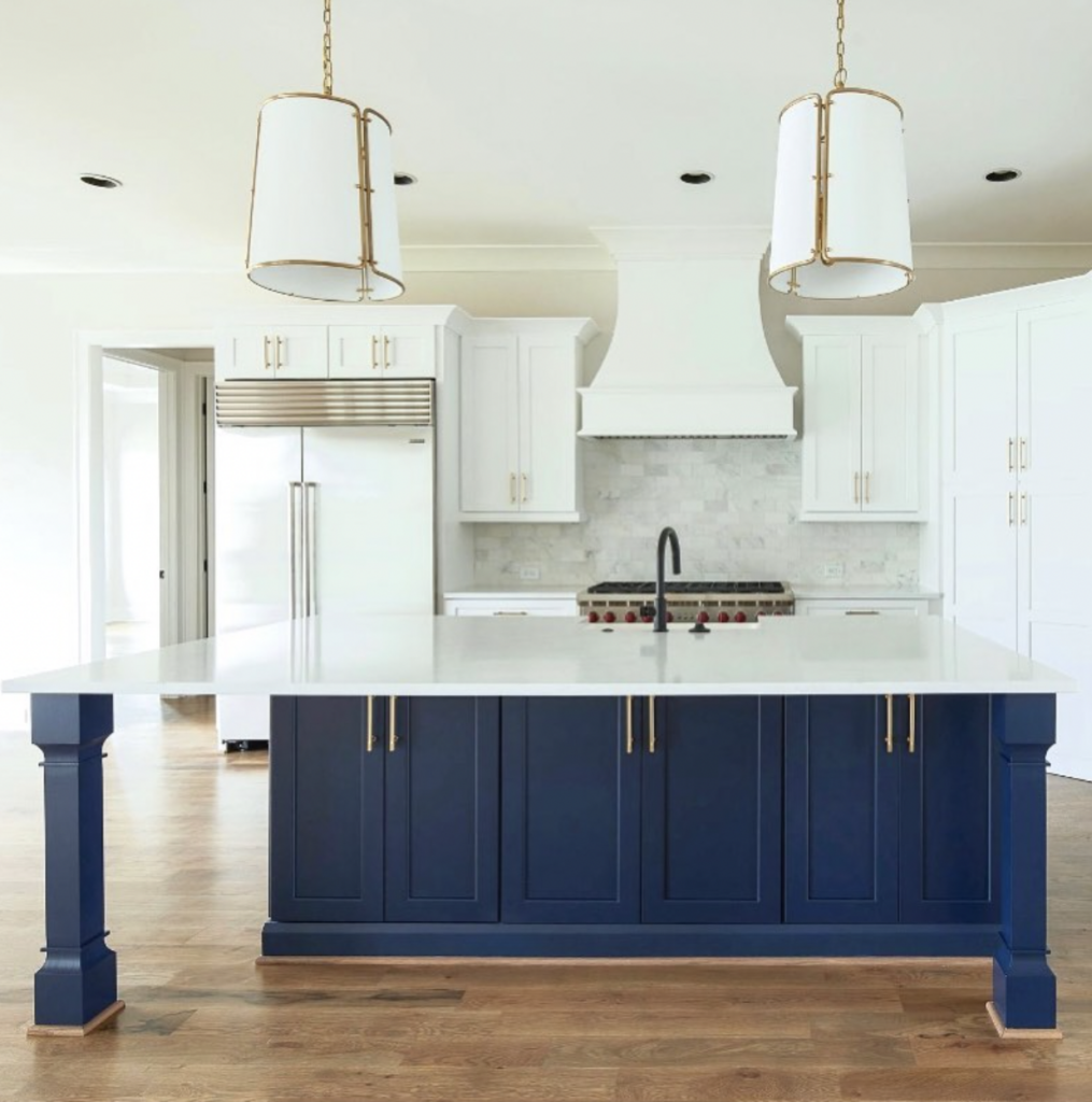 White Cabinet Kitchen With Black Faucet and Island