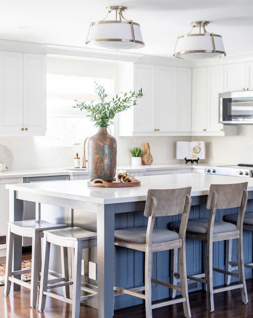White Cabinets and a Painted Blue Island with Rustic Stools