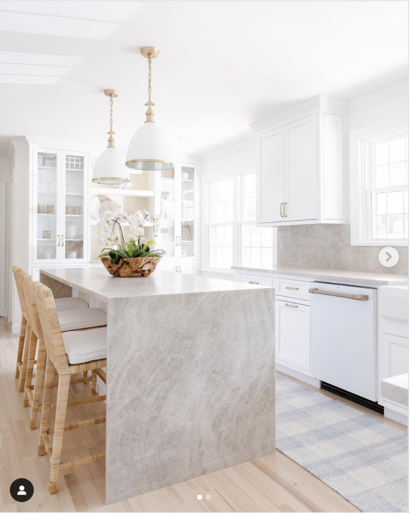 White cabinets beside light wood floors